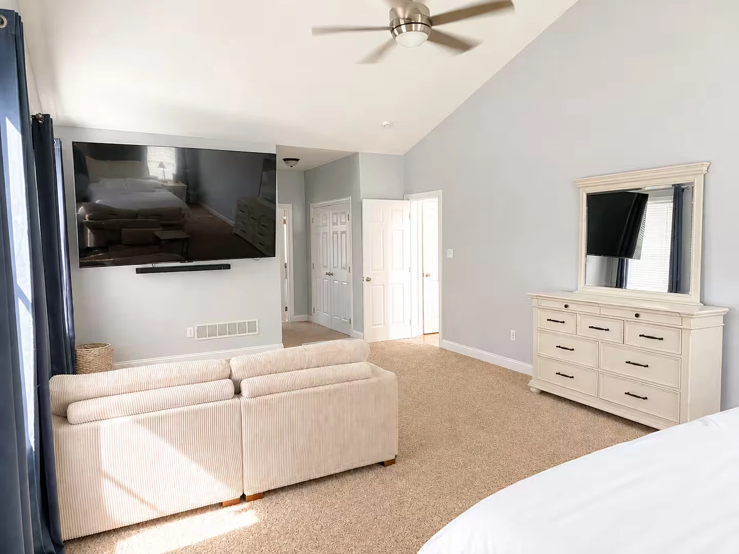 Actual Augusta Lane primary bedroom sitting area with television
